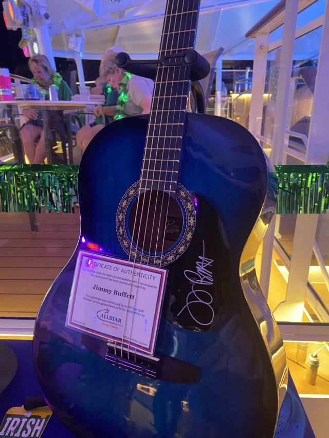 _2022-03-17_1019_Carribean_NorweiganJoy_SpiceH2O_Auction_JimmyBuffett-SignedGuitar